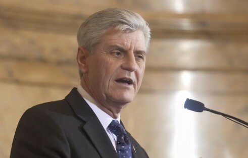 Mississippi governor signs law over protests of gay rights advocates